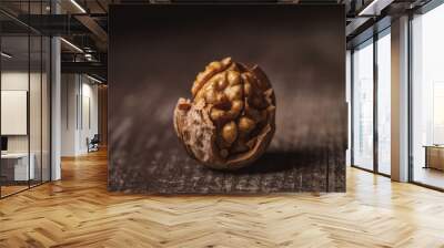 close up view of shelled walnut on wooden tabletop Wall mural