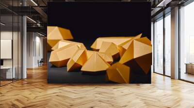 close-up view of shiny faceted golden nuggets on black Wall mural