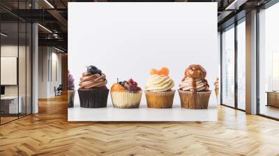 close up view of various sweet cupcakes isolated on white Wall mural