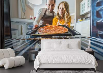 couple with burnt pizza Wall mural