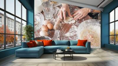 cropped shot of woman preparing cookies with cutter Wall mural