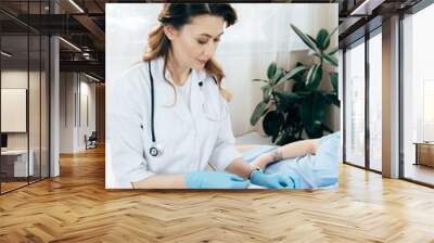 cropped view of donor and doctor with syringe obtaining blood sample Wall mural