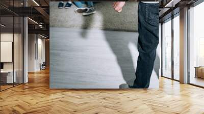 cropped view of father and scared children sitting on carpet Wall mural