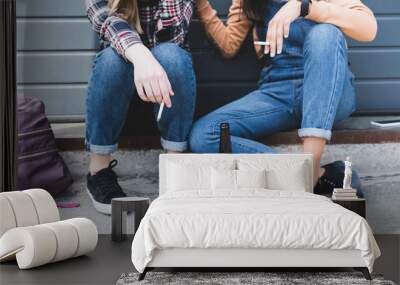 cropped view of teens smoking cigarettes, holding beer and sitting Wall mural