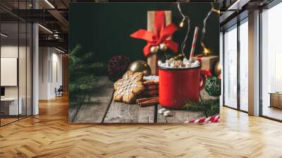 cup of hot cocoa with marshmallows on wooden table with christmas gingerbread Wall mural