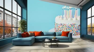 Delicious Birthday cake with lighting candles on blue background Wall mural