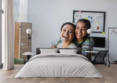 excited african american girl embracing mother while looking at camera Wall mural