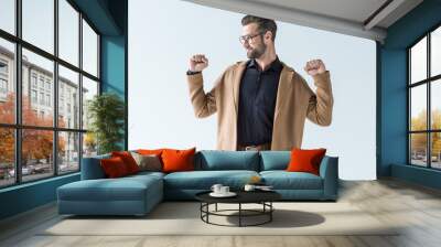 excited man gesturing and posing in autumn brown coat, isolated on white Wall mural