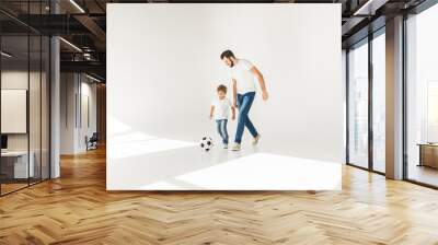 father and son with soccer ball Wall mural