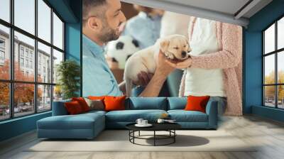 father giving his daughter adorable labrador puppy Wall mural