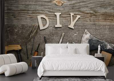 Flay lay with different carpentry tools and diy sign on wooden background Wall mural