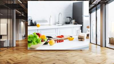 fresh healthy vegetables, cutting board and spices on kitchen table Wall mural