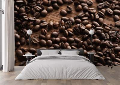 fresh roasted coffee beans scattered on wooden table Wall mural