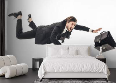 frightened young businessman falling with briefcase isolated on white Wall mural