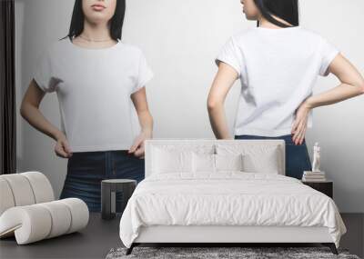 front and back view of young woman in blank t-shirt isolated on white Wall mural