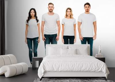 full length view of serious young men and women in white t-shirts and denim pants standing and looking at camera isolated on white Wall mural