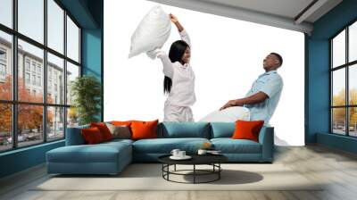 happy african american couple having pillow fight in bed in pajamas isolated on white Wall mural