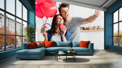 happy man and woman taking selfie on valentines day Wall mural