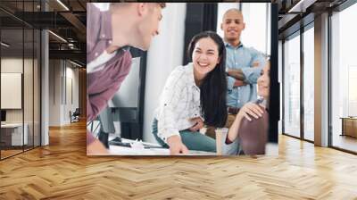 happy young business people laughing while working together in office Wall mural