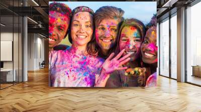 happy young multiethnic friends having fun with colorful powder at holi festival of colors Wall mural