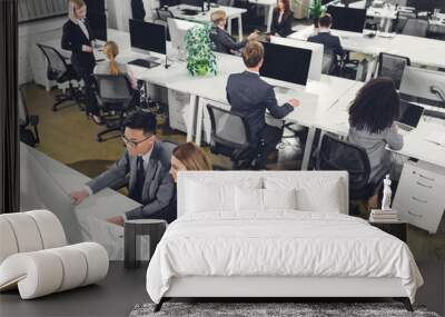 high angle view of multiethnic business people working with papers and desktop computers in office Wall mural