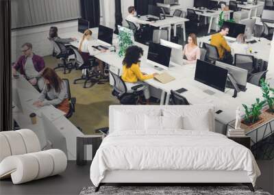 high angle view of young multiethnic business people working in open space office Wall mural