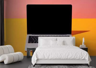 laptop with blank screen on yellow surface and pink background Wall mural