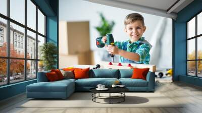 Little boy with tools Wall mural