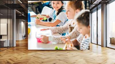 little happy schoolgirls taking lunch at school cafeteria Wall mural