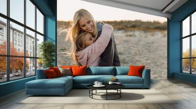 mother embracing her daughter Wall mural