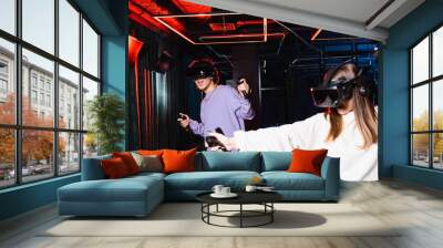 multiethnic teenagers in headsets gaming in vr play room Wall mural