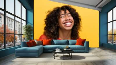 overjoyed african american woman smiling with closed eyes isolated on yellow. Wall mural