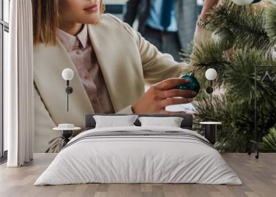 panoramic shot of businesswoman standing near decorated christmas tree in office Wall mural