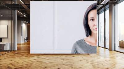 panoramic shot of depressed brunette woman looking at camera at home with copy space Wall mural