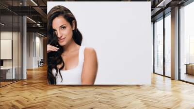 panoramic shot of smiling brunette beautiful woman with long healthy and shiny hair isolated on grey Wall mural