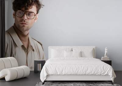 panoramic shot of stylish man in eyeglasses looking away while posing isolated on grey Wall mural