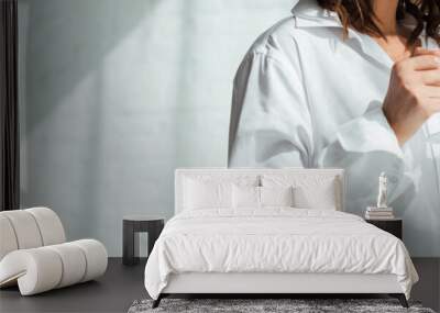 panoramic shot of woman in white shirt holding cup at morning Wall mural