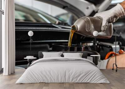 partial view of mechanic pouring motor oil at car engine Wall mural