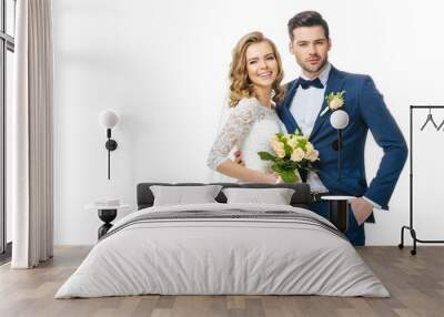 portrait of smiling bride with wedding bouquet and groom isolated on white Wall mural