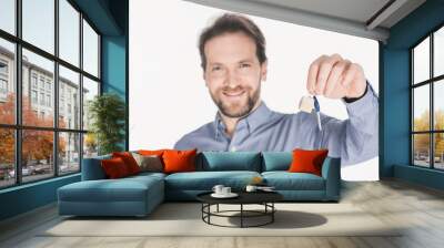 portrait of smiling man showing key from new house in hand isolated on white Wall mural