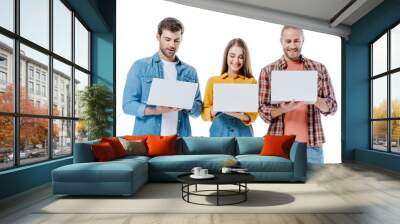 positive young friends using laptops isolated on white Wall mural