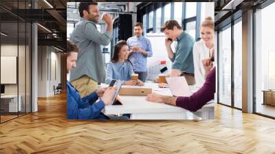 professional businesspeople discussing and brainstorming together on workplace in office, young professional group concept Wall mural