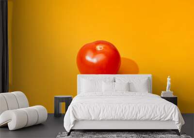 ripe fresh tomato on orange background Wall mural