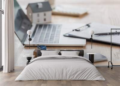 selective focus of keys near laptop, smartphone, clipboard and house model on wooden table Wall mural