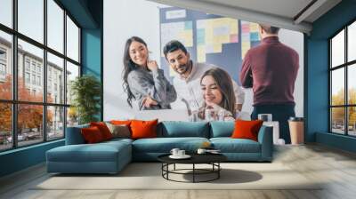 selective focus of multicultural businesswomen and businessman working in office Wall mural