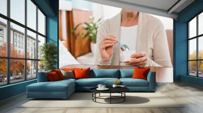 senior woman eating in hospital Wall mural