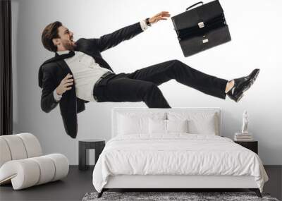 shouting young businessman falling with briefcase isolated on white Wall mural