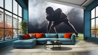 silhouette of american football player in star position against white smoke Wall mural