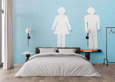 small ball and pencil with paper cut of couple isolated on blue, sexual equality concept Wall mural