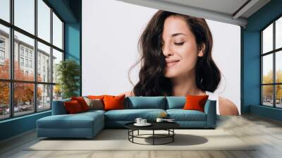 smiling brunette beautiful woman with closed eyes and long healthy and shiny hair isolated on grey Wall mural